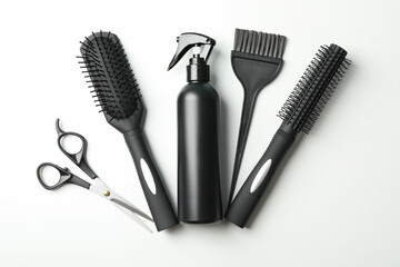 Composition with hairdresser accessories on white background