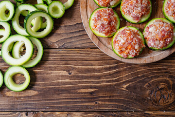 Fresh green zucchini cut into circles prepared for stuffing