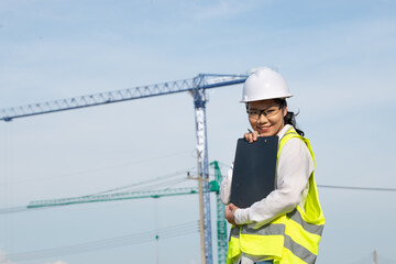 Asian engineer working at site of a large building project,Thailand people,Work overtime at construction site