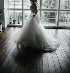 young slender bride in a long white elegant wedding dress. honeymoon ceremony