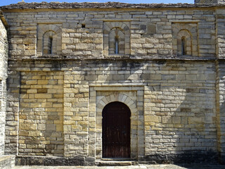 South facade and door of the Mozarab Pre-Romanesque or Romanesque Church of San Pedro de Larrede in the Serrablo Region. 10th-11th century. Aragon. Spain. 