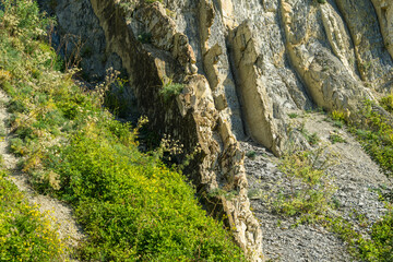 Beautiful natural texture of Caucasus mountains on the Black Sea coast in Olginka. Stones and rock fragments of different sizes as original background. Selective focus
