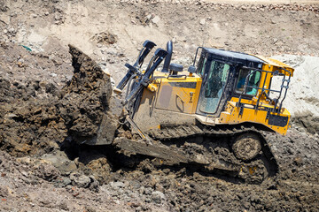 Bulldozer push large quantities of soil