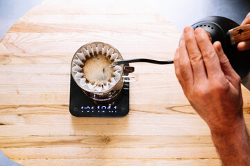 Barista preparing coffee with filter