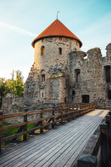 Fototapeta na wymiar View on beautiful ruins of ancient Livonian castle in old town of Cesis, Latvia, warm sunset time.