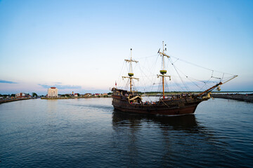 Ships in the sea at sunset