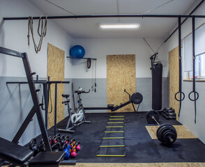 Fototapeta na wymiar Small home made gym with professional equipment