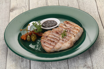 Grilled pork steak with pepper sauce