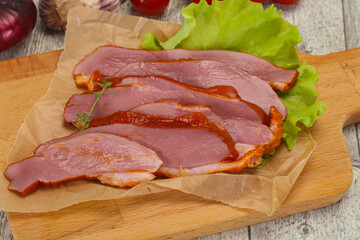 Sliced smoked duck breast served salad