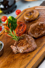 Tenderloin Steak Roast beef on wooden cutting board on wooden background
