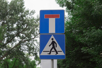 Dead end and pedestrian crossing road sign