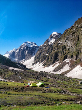 Beautiful high altitude campsite among mighty Indian Himalayan Mountain valley.