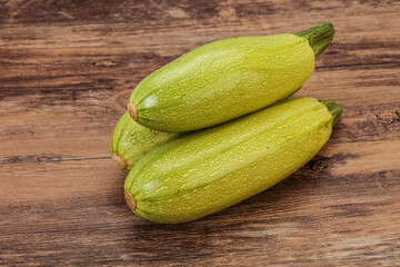 Young tasty zucchini over board