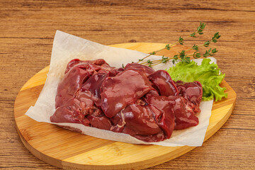 Raw chicken liver over board