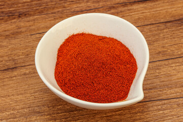 Dry paprika powder in the bowl