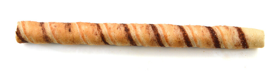 Heap of striped wafer tubules with the chocolate cream, isolated,