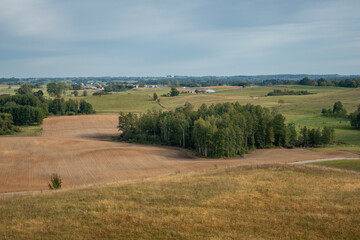 Fototapeta na wymiar View of the fields (typical landscape near Suwalki) from the observation tower in Baranowo, Podlaskie, Poland