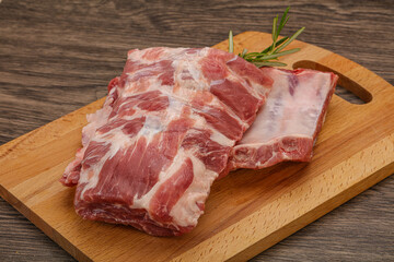 Raw pork ribs served rosemary
