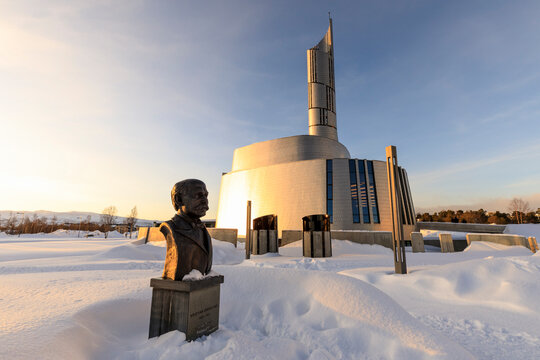 Northern Lights Cathedral, titanium clad, deep snow in winter, sunset golden hour, Alta, Troms og Finnmark