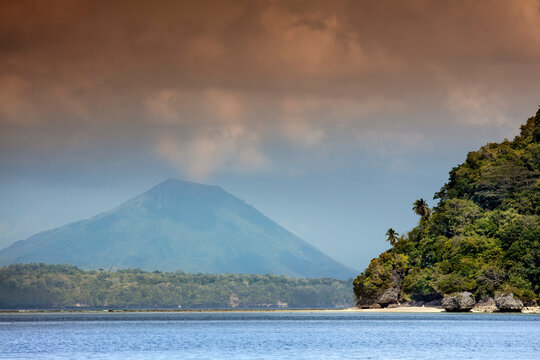View of the cone of Gunung Api Wetar volcano from Nailaka island, Banda Islands, Maluku, Spice Islands, Indonesia