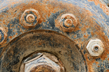 big wheel close view of old tractor as background