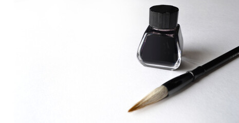 Ink bottle with brush for painting chinese painting on white