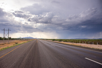 Empty road with clouds at countryside