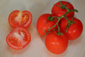 red tomatoes on a wooden table
