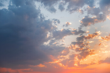 Naklejka na ściany i meble Beautiful colorful sunset sky with orange clouds. Nature sky background.