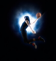 Basketball player players in action. Basketball on lightning background