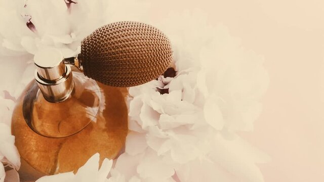 Vintage perfume bottle with peony flowers, chic fragrance scent as luxury cosmetic, retro fashion and beauty product backgrounds