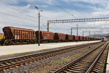 Fototapeta na wymiar Rail road tracks and train cars in Gori, Georgia