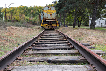 Abandoned Russian railroad tracks and locomotive from Soviet era, in Georgia, Caucasus