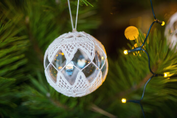 Christmas tree ball on a pine branch