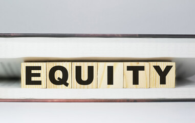Word EQUITY made with wood building blocks