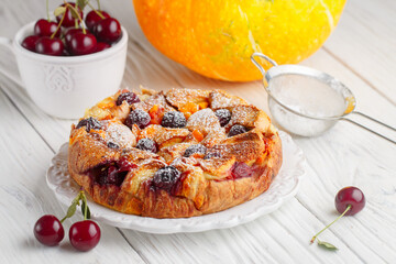 Homemade Bread and butter pudding with pumpkin and cherry berries.  Casserole. Traditional delicious sweet Breakfast for gourmets. Dessert. Selective focus