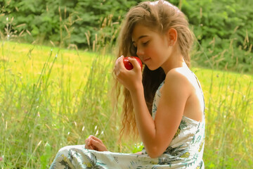 Beautiful summer girl with red apple