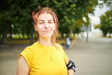 portrait of a young attractive sports women. outdoors. public park background. copy space. healthy lifestyles concept.