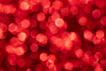 Red glitter festive background with bokeh lights. Celebration concept for Holidays and anniversary.