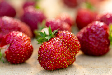 Fresh strawberries on a wooden table. Farmed organic food. Healthy eating.