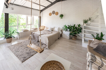 Luxury bedroom design in a rustic cottage in a minimalist style. white walls, panoramic windows,...