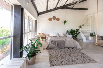 Luxury bedroom design in a rustic cottage in a minimalist style. white walls, panoramic windows,...