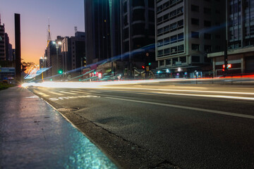 Fototapeta na wymiar Paulista avenue in Sao Paulo city, at night. Light trails and buildings