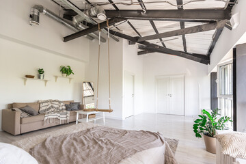 Luxury bedroom design in a rustic cottage in a minimalist style. white walls, panoramic windows, wooden elements of decoration on the ceiling, rope swings in the middle of a spacious room