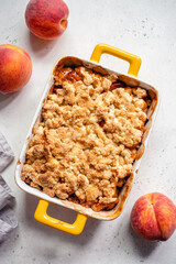 Peach cobbler dessert in a baking dish