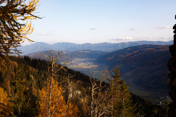 beautiful day in the austrian mountains with colorful trees and clouds