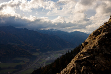beautiful day in the austrian mountains with colorful trees and clouds