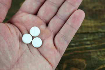 tablets in the palm of your hand