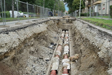 Civil engineering building site, with old  pipelines that are going to be replaced by new ones as a...