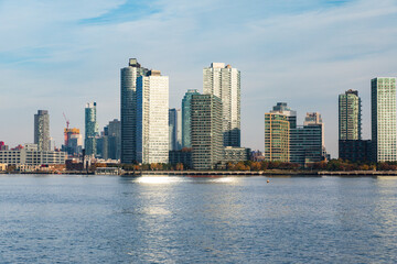 Fototapeta premium city in the background and a blue cloudy sky in summer